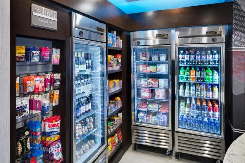 a refrigerator filled with lots of different types of drinks at SpringHill Suites Milford in Milford