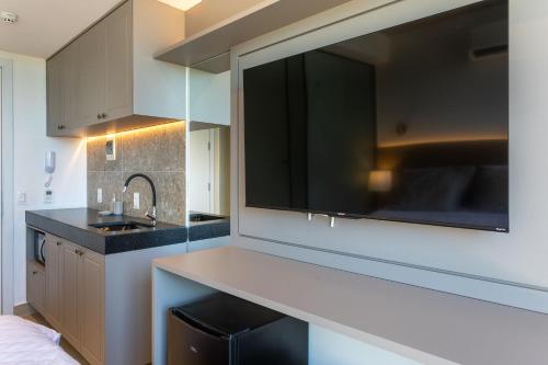 a kitchen with a sink and a counter top at Setai Yacht by DayByDay in João Pessoa