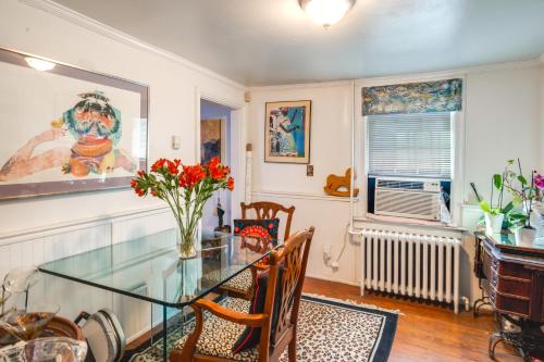 a dining room with a glass table and chairs at 1 Mi to Old Town Historic Area Gem in Alexandria in Alexandria