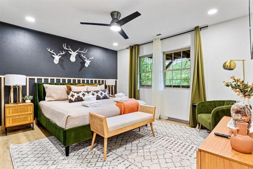 a bedroom with a bed and a living room at Stunning Mtn Cabin,Mtn Views,Hot Tub,Pet friendly in Waynesville