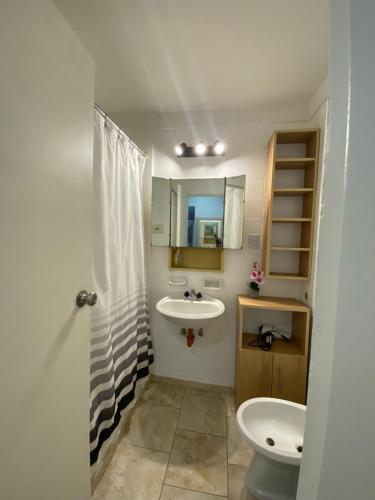 a bathroom with a sink and a toilet at Welcome to Buenos Aires in Buenos Aires