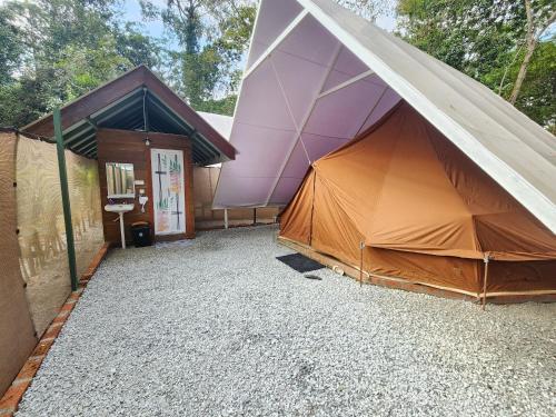 a large tent in front of a building at SkyTree Glamping in Batang Kali