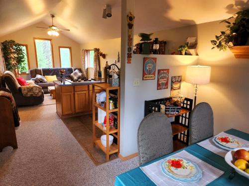 a kitchen and living room with a table and chairs at Soldotna Alaska 1 bedroom Split Level Guesthouse in Soldotna