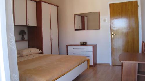 Postel nebo postele na pokoji v ubytování Apartment "Kod None"
