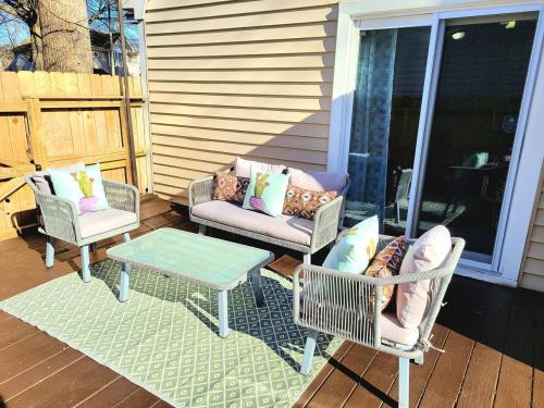 a patio with two chairs and a table on a porch at Beautiful home in Chesapeake in Chesapeake