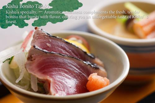 a bowl of food with a ham in it at KAMENOI HOTEL Kii-Tanabe in Tanabe