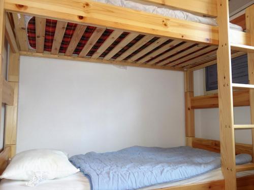 a bunk bed in a bedroom with a bunk bed in a room at Apartment, 600m from cable car in Veysonnaz