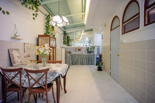 a dining room with a table and chairs at Ban Suanlum in Bangkok