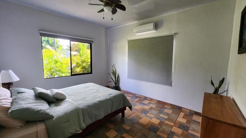 a bedroom with a bed and a window at Casa tipica in Fortuna