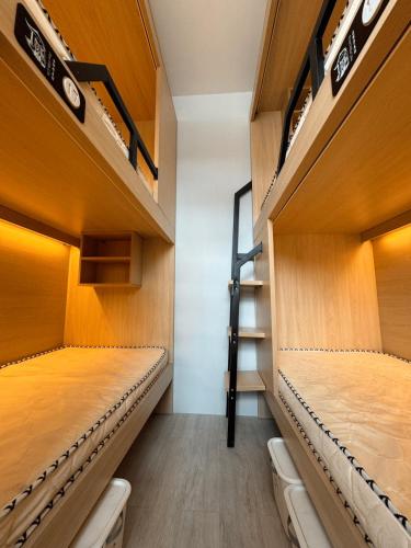 First Villa Life Hostel 民宿にあるベッド