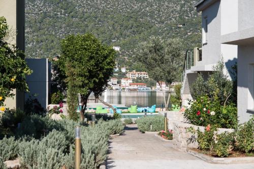 a garden with a view of the water at Lavender Cove in Korfos