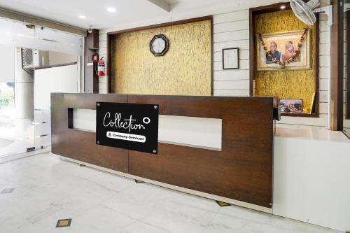 a lobby with a reception desk in a building at Super Collection O MP Nagar in Bhopal