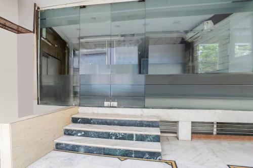 a building with stairs and a glass wall at Super Collection O MP Nagar in Bhopal
