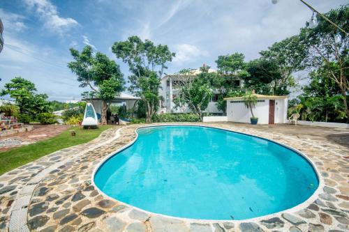 a swimming pool in the backyard of a villa at Casa de Arte in Boracay
