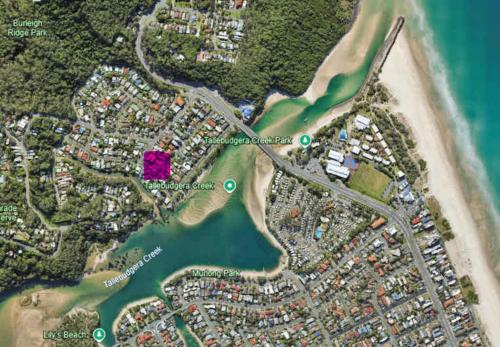 a map of a beach with a pink island at Driftwood By Khove in Gold Coast