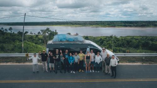 a group of people standing in front of a van at Amazon Curassow Lodge and Expeditions in Paraíso