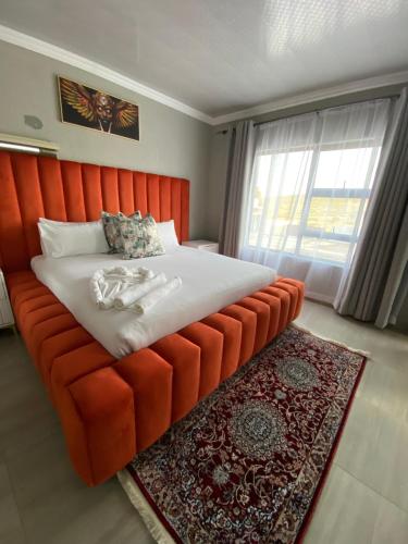 En eller flere senge i et værelse på Shibar farm house Mpumalanga