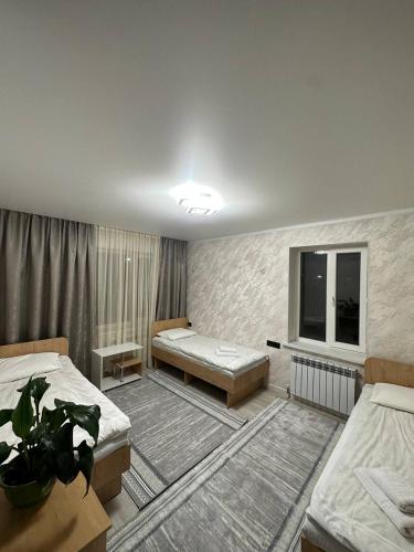 Postel nebo postele na pokoji v ubytování BUGU Guest House