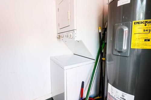 a refrigerator with a box on it next to a wall at NEW RENOVATED STUDIO Nr UCF PETSOK PRIVATE ENTRY in Orlando
