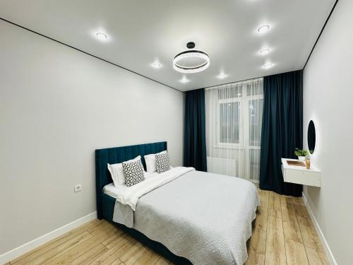 Postel nebo postele na pokoji v ubytování Alatau city 20