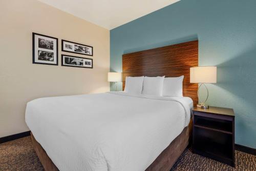 a large white bed in a hotel room at Sleep Inn & Suites Huntsville near US Space & Rocket Center in Huntsville