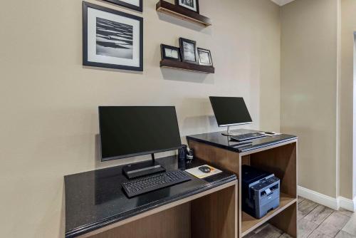 an office with a desk with a computer and a keyboard at Sleep Inn & Suites Huntsville near US Space & Rocket Center in Huntsville