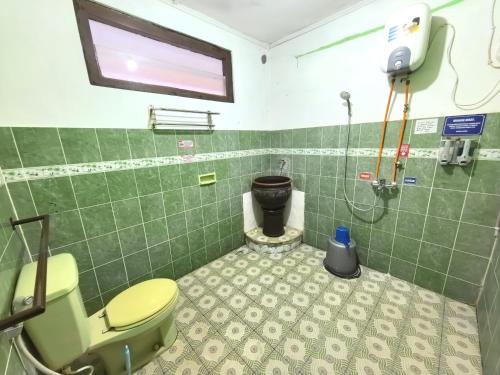 Ένα μπάνιο στο Bolo Nest Homestay Jogja