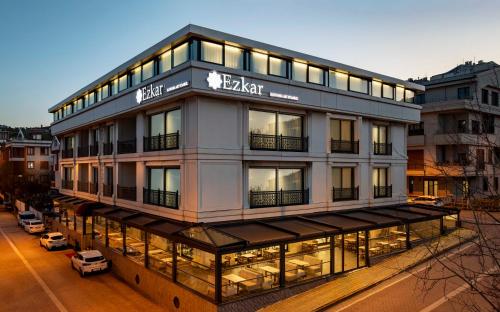 a building with a sign on top of it at Ezkar Bathonea Art İstanbul Hotel in Avcılar