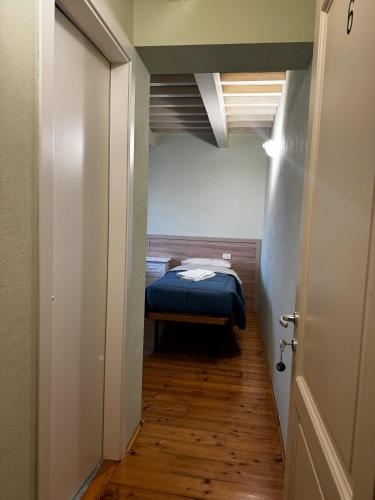 a hallway with a bed in a small room at Agriturismo Vivace in Tolentino