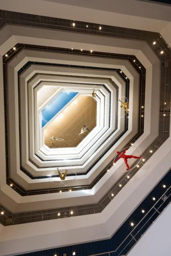 a coffered ceiling with a christmas bow on it at Leonardo Club Tiberias - All Inclusive in Tiberias