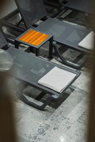 a picnic table with a bench and an orange seat at Riva Hotel Nişantaşı in Istanbul