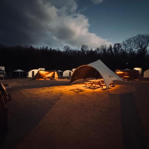 a group of tents in a parking lot at NTV Smoky Garden in Owariasahi