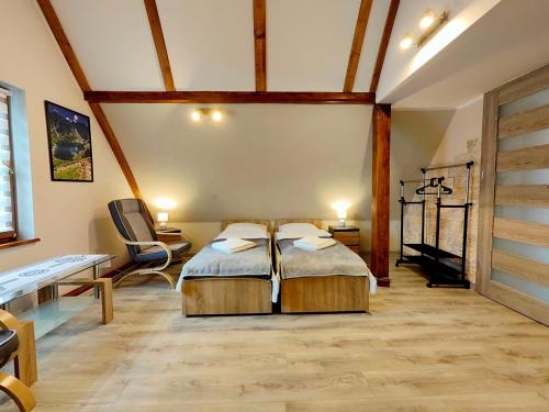 Postel nebo postele na pokoji v ubytování Apartamenty Rodzinne