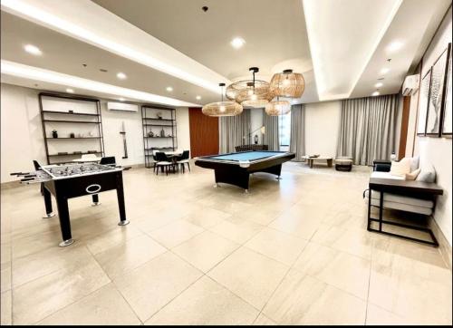 a large room with a pool table in it at Hidden Gem at Cebu Business Park in Cebu City