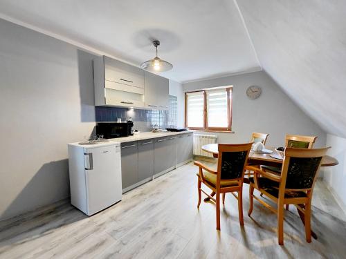 Kuchyň nebo kuchyňský kout v ubytování Apartamenty Rodzinne