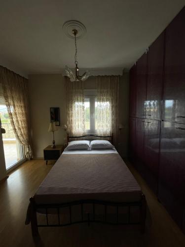 Postel nebo postele na pokoji v ubytování Η Αυλή
