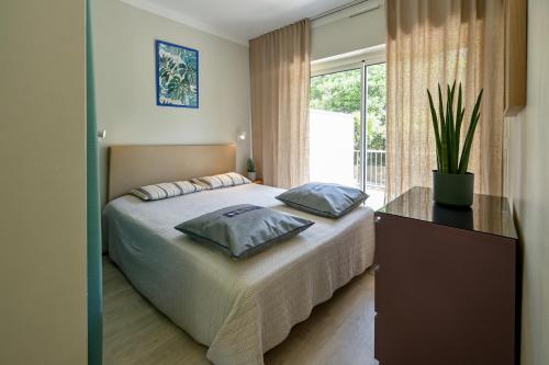 Ένα ή περισσότερα κρεβάτια σε δωμάτιο στο Résidence La Ménado