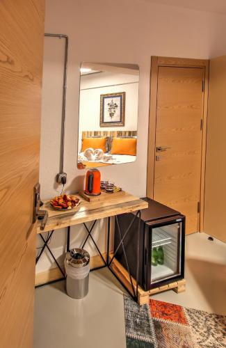 a dressing table in a room with a mirror at Vavien Hotel in Istanbul