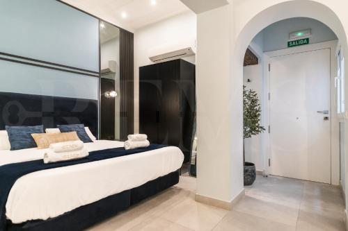 Ένα ή περισσότερα κρεβάτια σε δωμάτιο στο Modern studio in the heart of Malaga by REMS