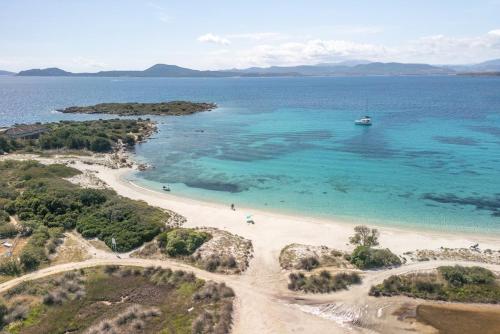 an aerial view of a beach with a boat in the water at Vista Playa 1 in Isola di Porticciuolo