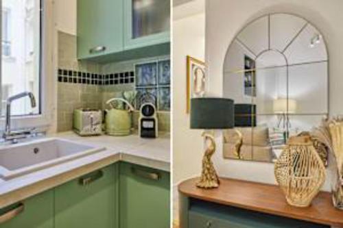 une cuisine avec des armoires vertes et un évier dans l'établissement Superb Apartment Le Marais Place des Vosges, à Paris