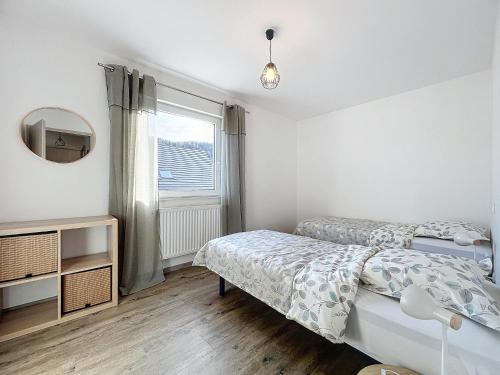 Postel nebo postele na pokoji v ubytování Hopla Gîte