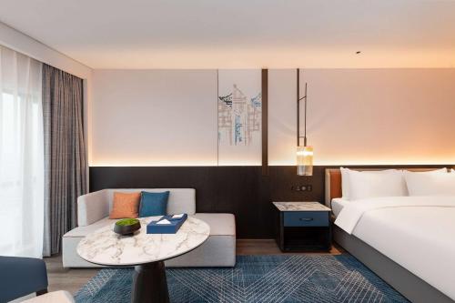 Ένα ή περισσότερα κρεβάτια σε δωμάτιο στο Wyndham Putian Downtown