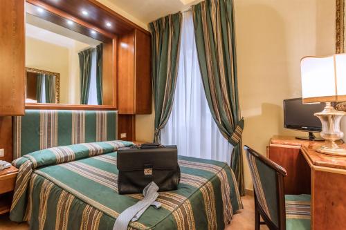 Postel nebo postele na pokoji v ubytování Raeli Hotel Regio