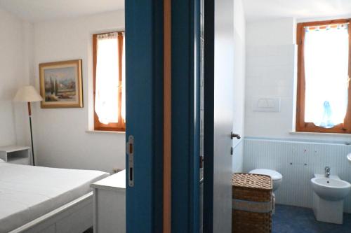a bathroom with a bed and a toilet and a sink at Trilocale a 150 mt dal mare di Marcelli - M244 in Marcelli