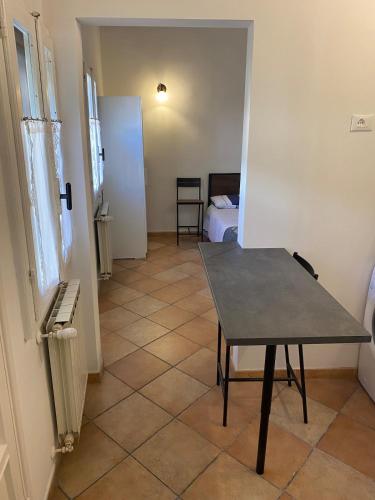 a room with a table and a room with a bed at Casa Luna in Florence