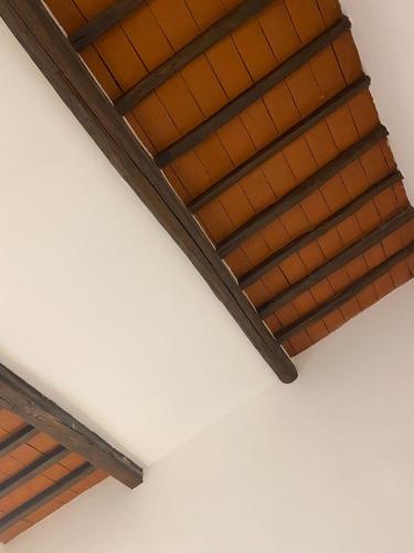 a ceiling with a wooden roof in a room at Casa Luna in Florence