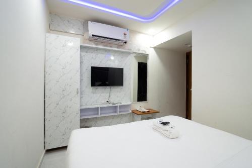 TV a/nebo společenská místnost v ubytování Hotel Nest Sky