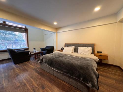 En eller flere senge i et værelse på Alpine Guest House