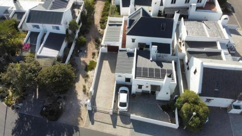 an overhead view of a white house with a solarium at Baywatch Paternoster - The Cottage in Paternoster